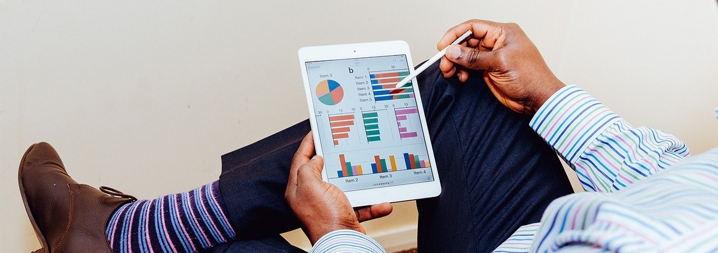 marketer explaining dashboard on an iPad